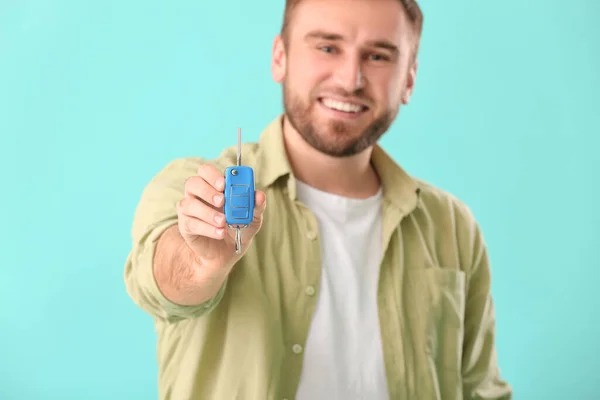 Young Man Car Key Color Background — Stock Photo, Image