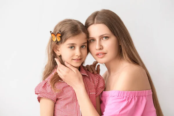 Beautiful Young Woman Her Little Daughter Butterfly Light Background — Stock Photo, Image