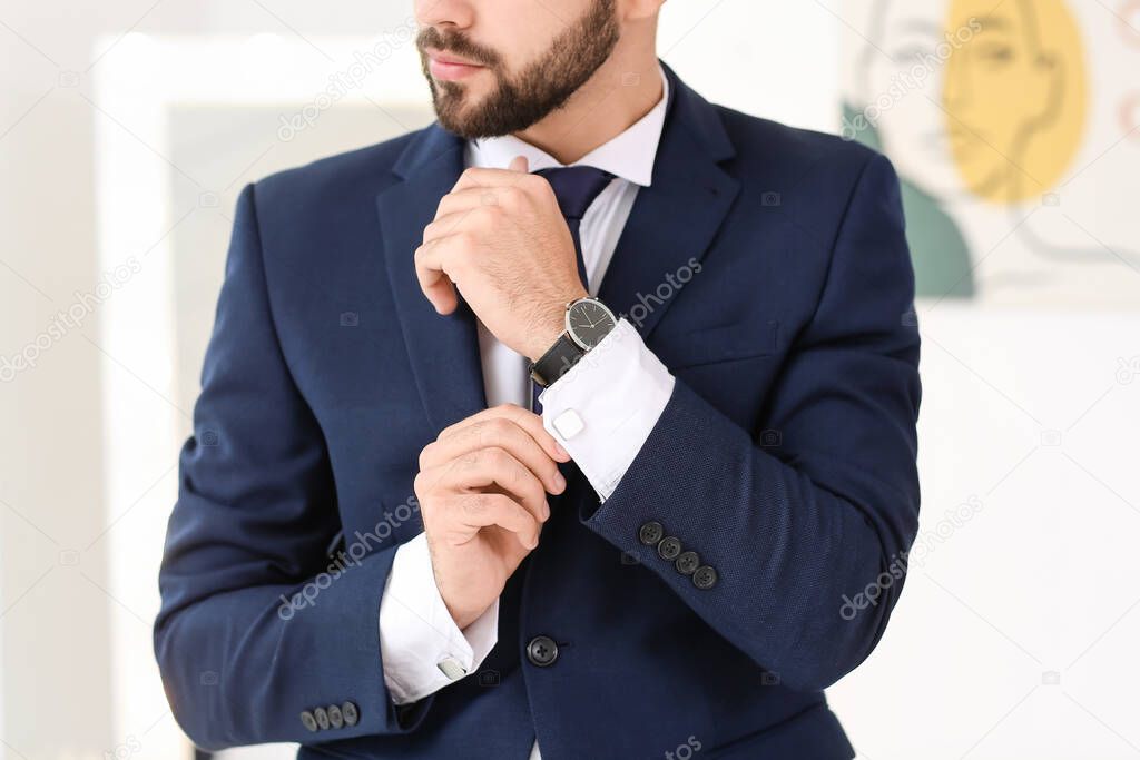 Stylish young man in suit indoors