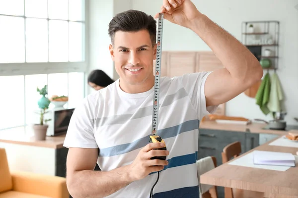 Young Man Measuring Tape Kitchen — Stock Photo, Image