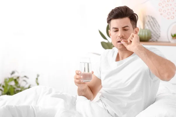 Young Man Taking Sleeping Pills Bedroom — Stock Photo, Image