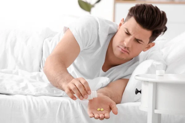 Young Man Taking Sleeping Pills Bedroom — Stock Photo, Image