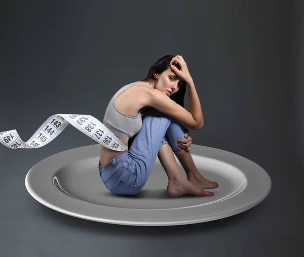 Small Woman Measuring Tape Sitting Plate Grey Background Concept Anorexia — Stock Photo, Image