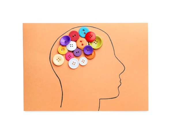 Paper with drawn human head and buttons on white background. Neurology concept