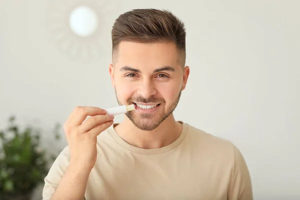 Handsome Young Man Lip Balm Home — Stock Photo, Image