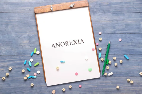 Paper Sheet Text Anorexia Pills Color Wooden Background — Stock Photo, Image