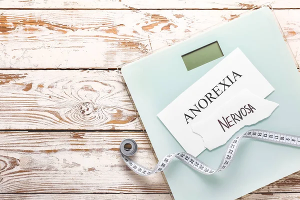 Scales Measuring Tape Text Anorexia Nervosa White Wooden Background — Stock Photo, Image