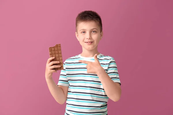 Cute Little Boy Eating Chocolate Color Background — Stock Photo, Image