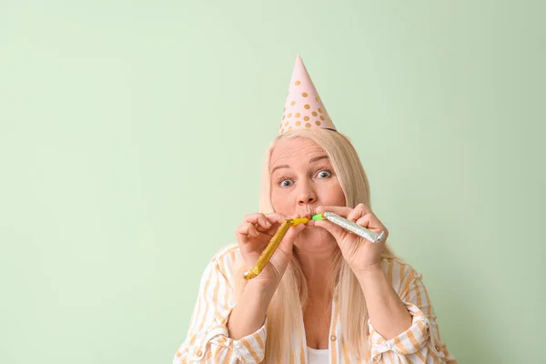 Mature Woman Celebrating Birthday Color Background — Stock Photo, Image