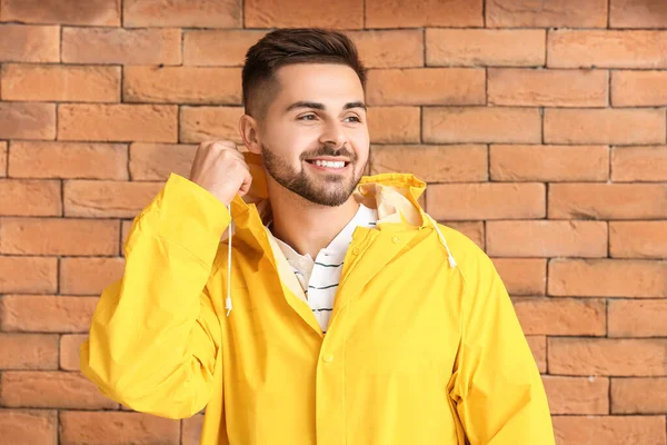 Young Man Raincoat Brick Background — Stock Photo, Image