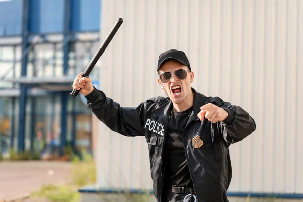 Aggressive Police Officer Baton Outdoors — Stock Photo, Image