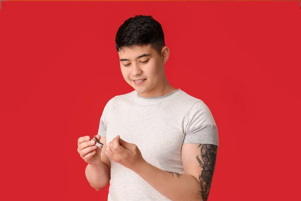 Asian Man Doing Manicure Color Background — Stock Photo, Image