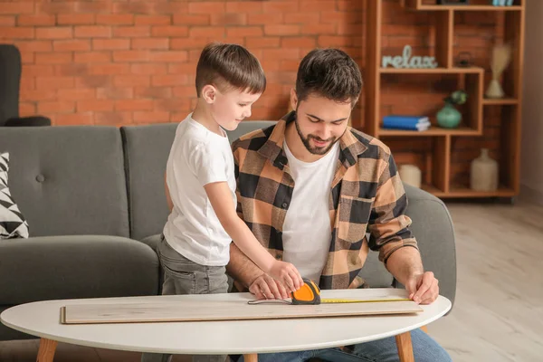 Father Son Taking Measures Wooden Plank Home — Stock Photo, Image