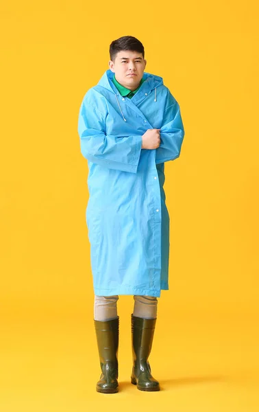 Young Asian Man Raincoat Color Background — Stock Photo, Image