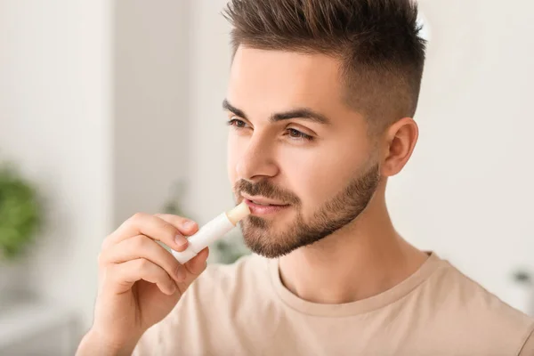 Handsome Young Man Lip Balm Home — Stock Photo, Image