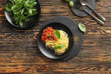 Plate with tasty pasta bolognese on table