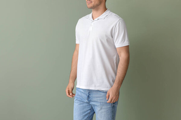 Young man in stylish t-shirt on color background