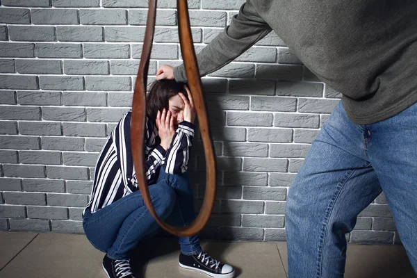 Aggressive Man Belt Scared Young Woman Room — Stock Photo, Image