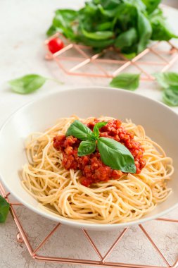 Plate with tasty pasta bolognese on table