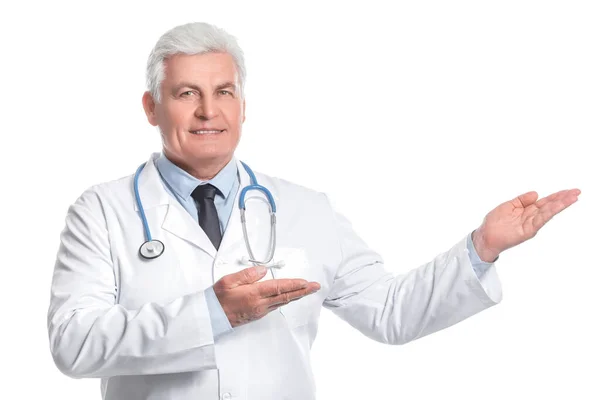 Portrait Senior Doctor Showing Something White Background — Stock Photo, Image