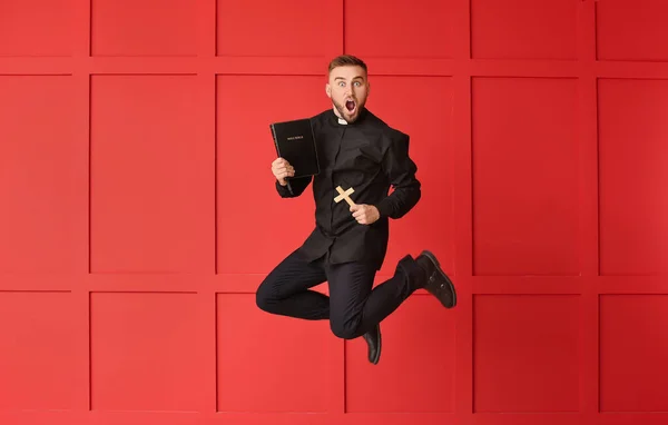Jumping Young Priest Color Background — Stock Photo, Image