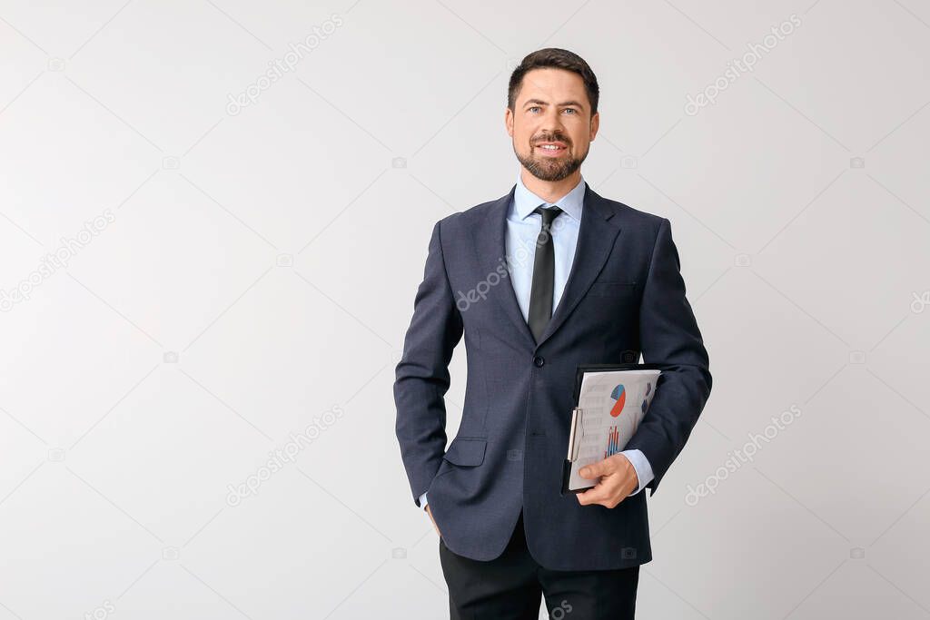 Portrait of businessman on light background