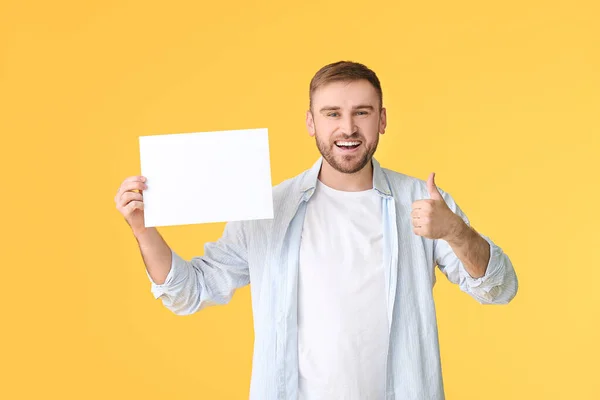 Young Man Blank Card Showing Thumb Color Background — Stock Photo, Image