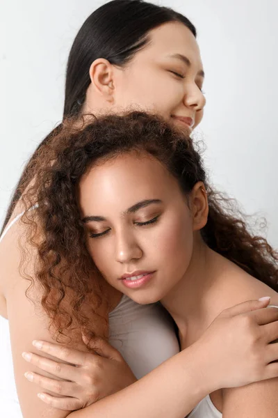 Women of different nationalities on white background. Stop racism