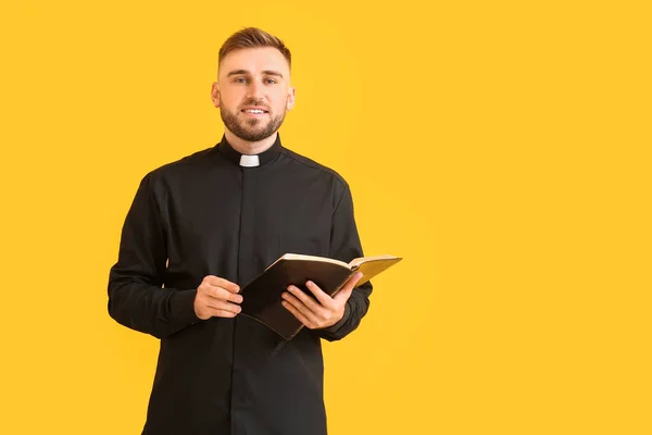 Handsome Young Priest Bible Color Background — Stock Photo, Image