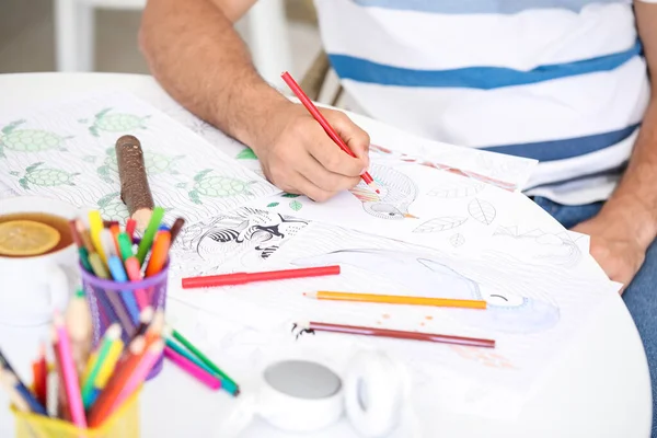 Young Man Coloring Pictures Home Closeup — Stock Photo, Image