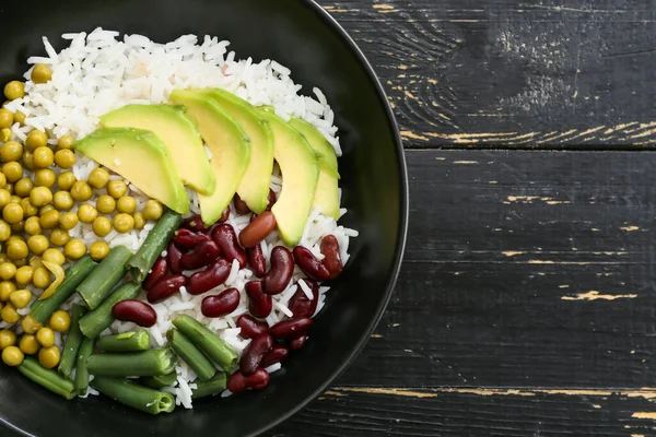 Bowl Tasty Rice Beans Avocado Table — Stock Photo, Image