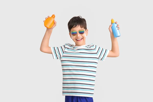 Little Boy Sun Protection Cream Grey Background — Stock Photo, Image