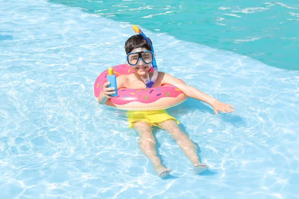 Little Boy Sun Protection Cream Inflatable Ring Swimming Pool — Stock Photo, Image