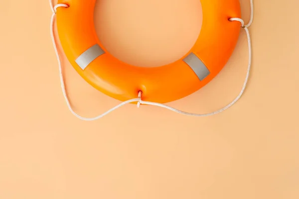 Lifebuoy ring on color background