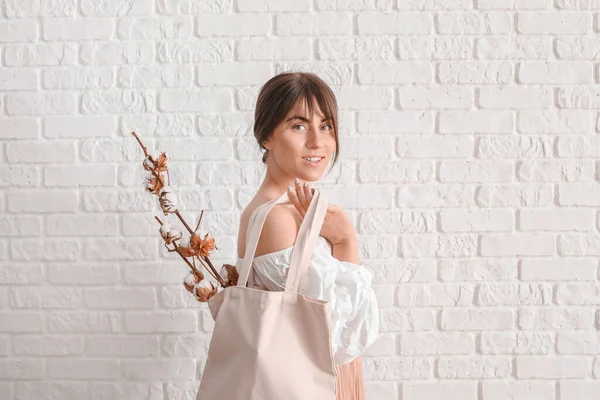 Beautiful Young Woman Cotton Flowers Shopping Bag White Brick Background — Stock Photo, Image