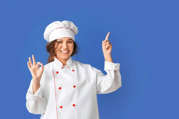 Female African American Chef Showing Color Background — Stock Photo, Image