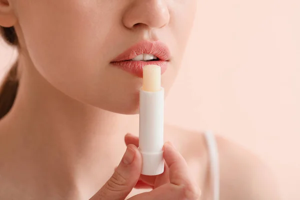 Beautiful Young Woman Lip Balm Color Background Closeup — Stock Photo, Image