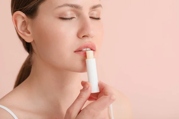 Beautiful Young Woman Lip Balm Color Background — Stock Photo, Image