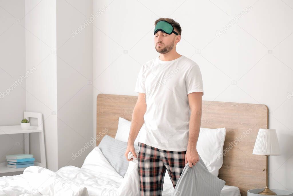 Male sleepwalker in his bedroom