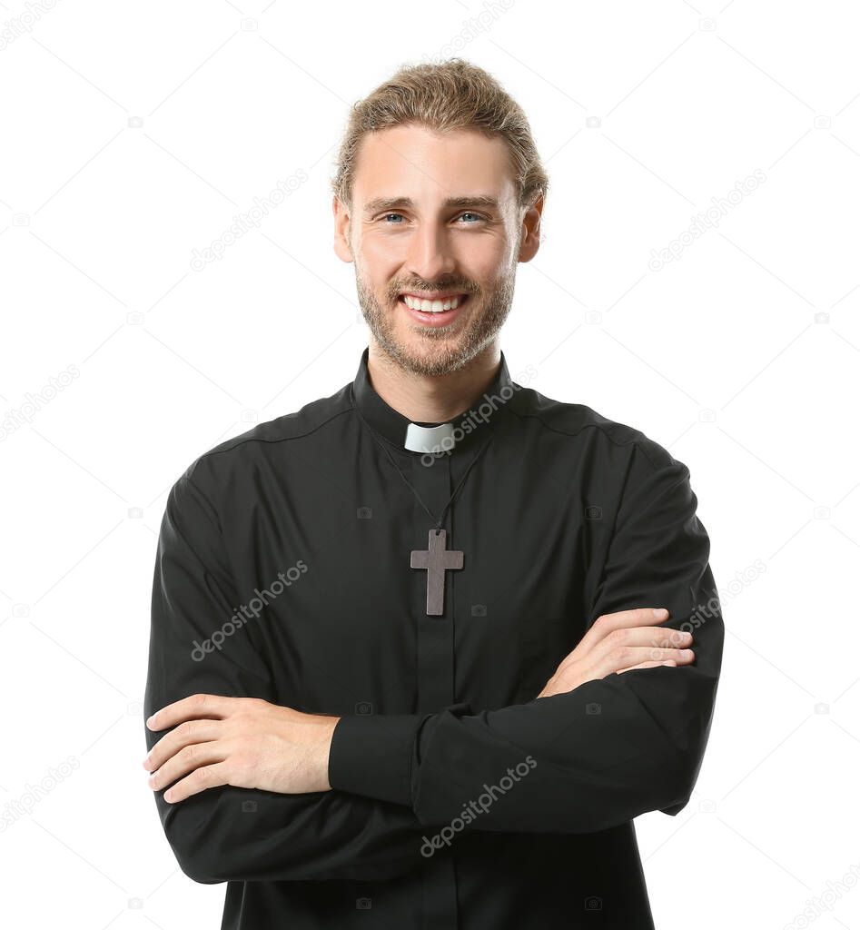 Handsome priest on white background