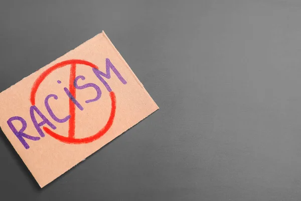 Placard Crossed Out Word Racism Dark Background — Stock Photo, Image