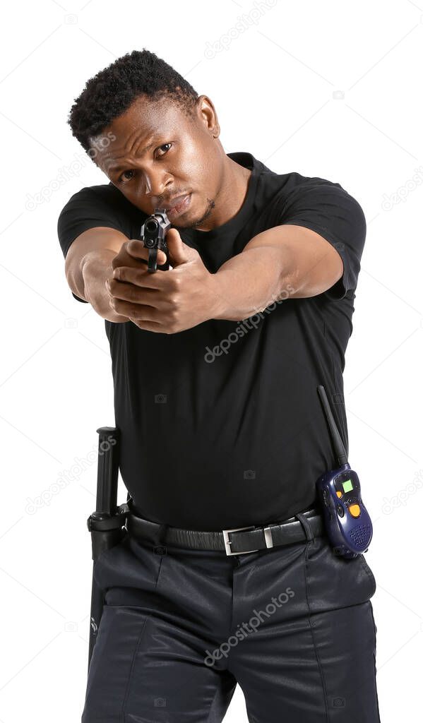 Aggressive African-American police officer with gun on white background