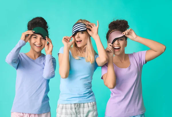 Beautiful Young Women Pajamas Sleep Masks Color Background — Stock Photo, Image