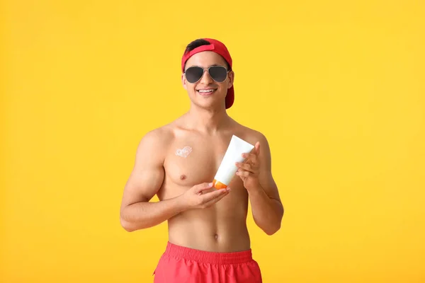 Happy Young Man Sun Protection Cream Color Background — Stock Photo, Image