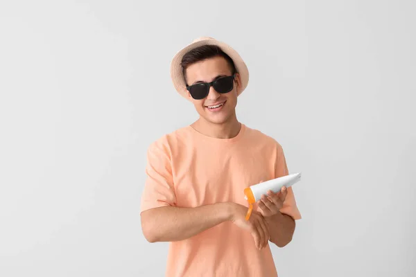 Happy Young Man Sun Protection Cream Light Background — Stock Photo, Image