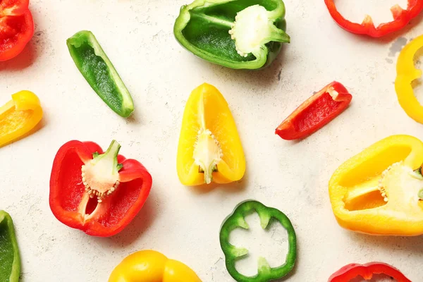 Cut bell peppers on white background