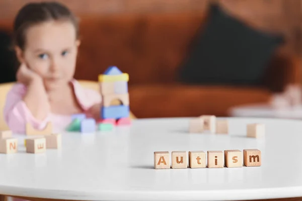 Wooden Cubes Word Autism Table Little Girl — Stock Photo, Image
