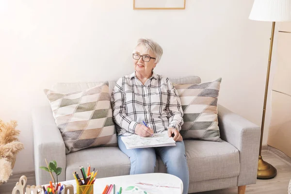 Senior Woman Coloring Picture Home — Stock Photo, Image