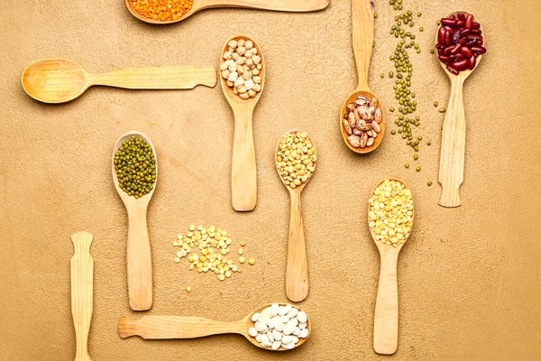 Spoons Raw Legumes Color Background — Stock Photo, Image