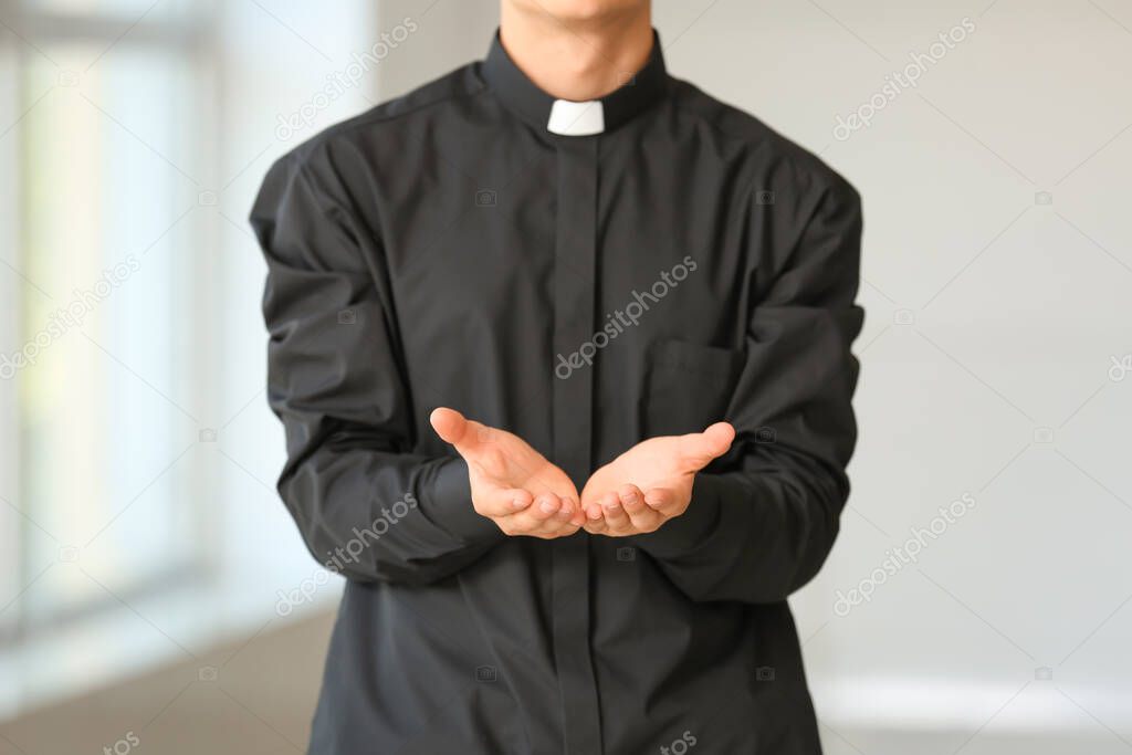 Male priest at home, closeup